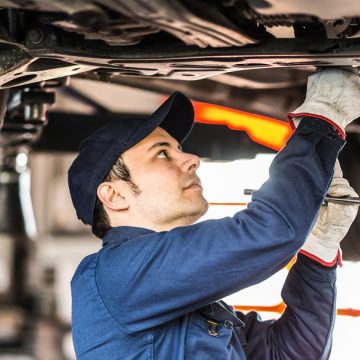 mechanic repairing a land rover